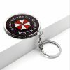 0b402aa9-27f4-42e4-9a38-5c5aa802be6b.jpg سلسلة مفاتيح Umbrella Corporation – رمز Biohazard الشهير
