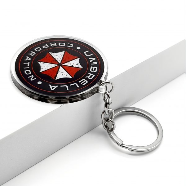 0b402aa9-27f4-42e4-9a38-5c5aa802be6b.jpg سلسلة مفاتيح Umbrella Corporation – رمز Biohazard الشهير