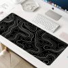 64bd49af-d3ec-4dc9-b9cb-4a30b683ec6d.jpg Extra-Large Gaming Mouse Pad – تصميم أنيق أبيض وأسود لعشاق الـSetup النظيف