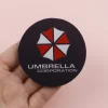 S83d9b08ae0f248cdbea9c5dead56ca21e.webp طقم قواعد أكواب بتصميم Umbrella من لعبة Resident Evil (عدد 2 قطعة)