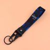 de9b828a402445b99158d5fedeb8e5b8-goods.jpeg سلسلة مفاتيح أنمي – تصميم شخصيات لطيف مع نقشة دوامات زرقاء وسوداء