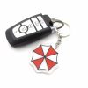 f95038b1-5861-4697-bb68-4daad97abebc.jpg سلسلة مفاتيح Umbrella Corporation – رمز Biohazard الشهير