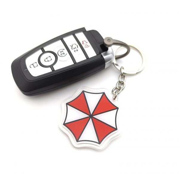 f95038b1-5861-4697-bb68-4daad97abebc.jpg سلسلة مفاتيح Umbrella Corporation – رمز Biohazard الشهير